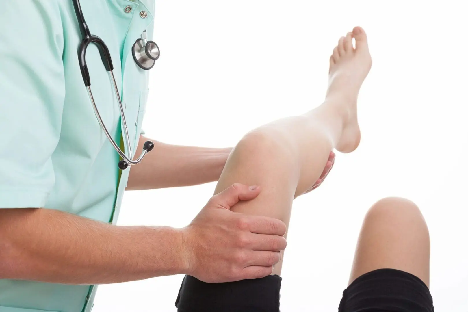 A doctor is examining the leg of a person.