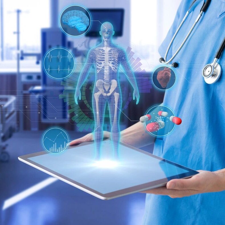 A doctor holding a tablet in his hand.